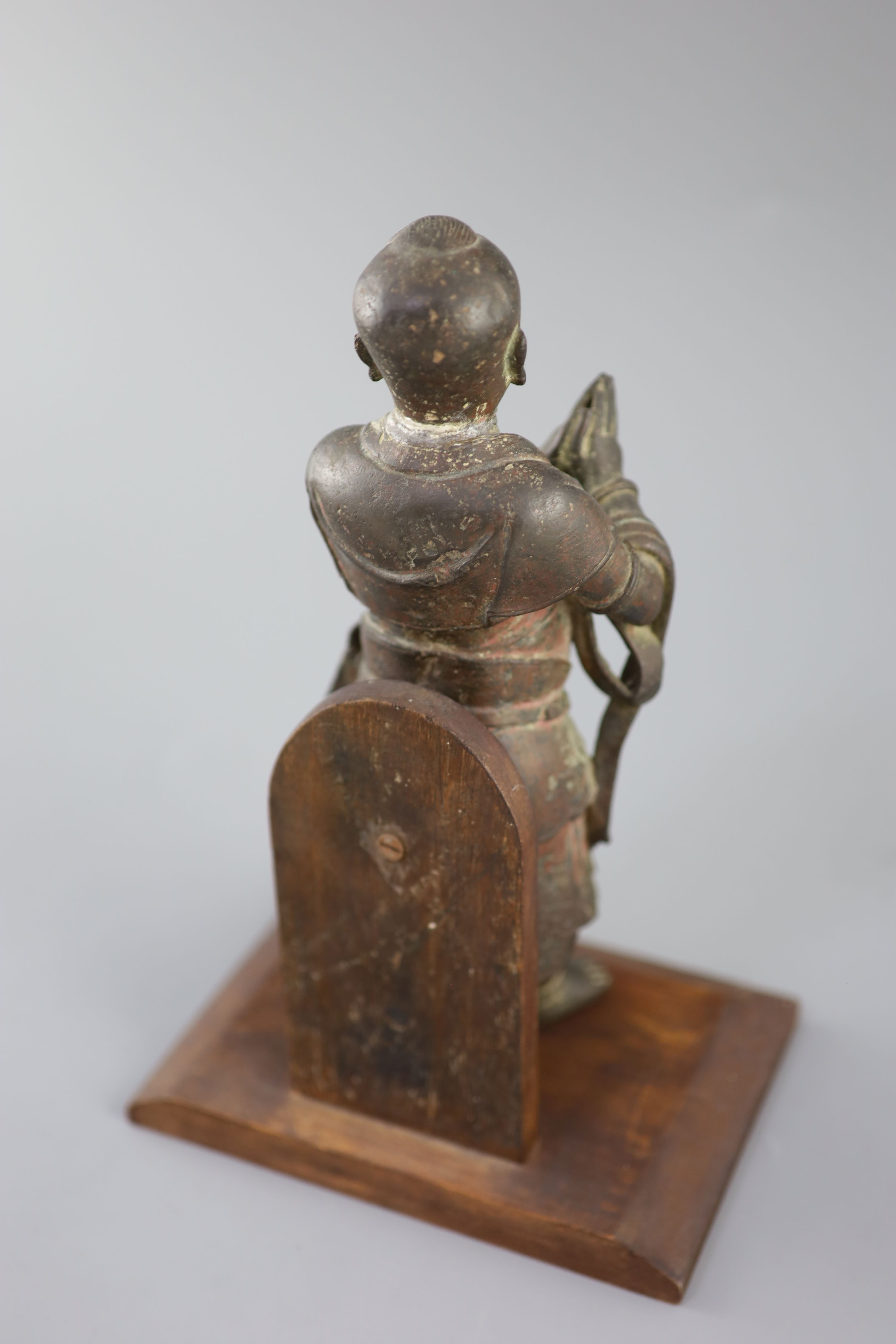 A Chinese bronze figure of Shancai Tongzi, late Ming dynasty, 25.5cm high, repairs, Provenance - A. T. Arber-Cooke